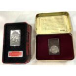 Two Zippo lighters commemorating their 60th & 65th anniversaries, tin cased