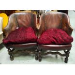 A pair of 1930's club armchairs with brown leather studded backs on turned legs with maroon