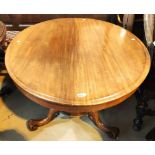 An oval tilt top mahogany supper table with base, 121cm.