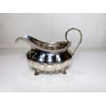 A Georgian sauce boat of lobed form, marks worn possibly London 1826 4.7oz