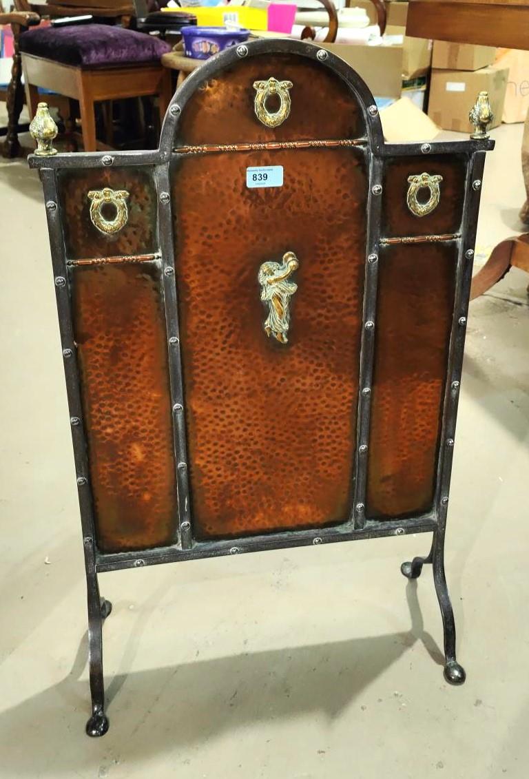 An Arts and Crafts beaten copper and steel fire screen with brass highlights, ht 77cm