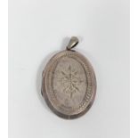 A late 19th century locket with incised decoration to the front and back