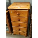 A modern pine five height chest of drawers, another pine glazed door record player cabinet
