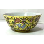 A Chinese yellow ground bowl, decorated to exterior with bats in different colours, 6 character to