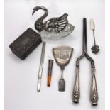 A pair of white metal handled and stone set early 20th century curling tongs other similar items
