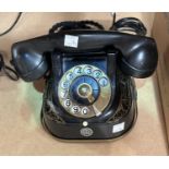 An early 20th century Jappaned rotary dial Bell telephone M F G company