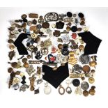 A selection of various military badges, buttons etc