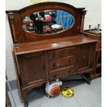 A 1920's walnut sideboard with mirror back, 2 cupboards and 3 drawers