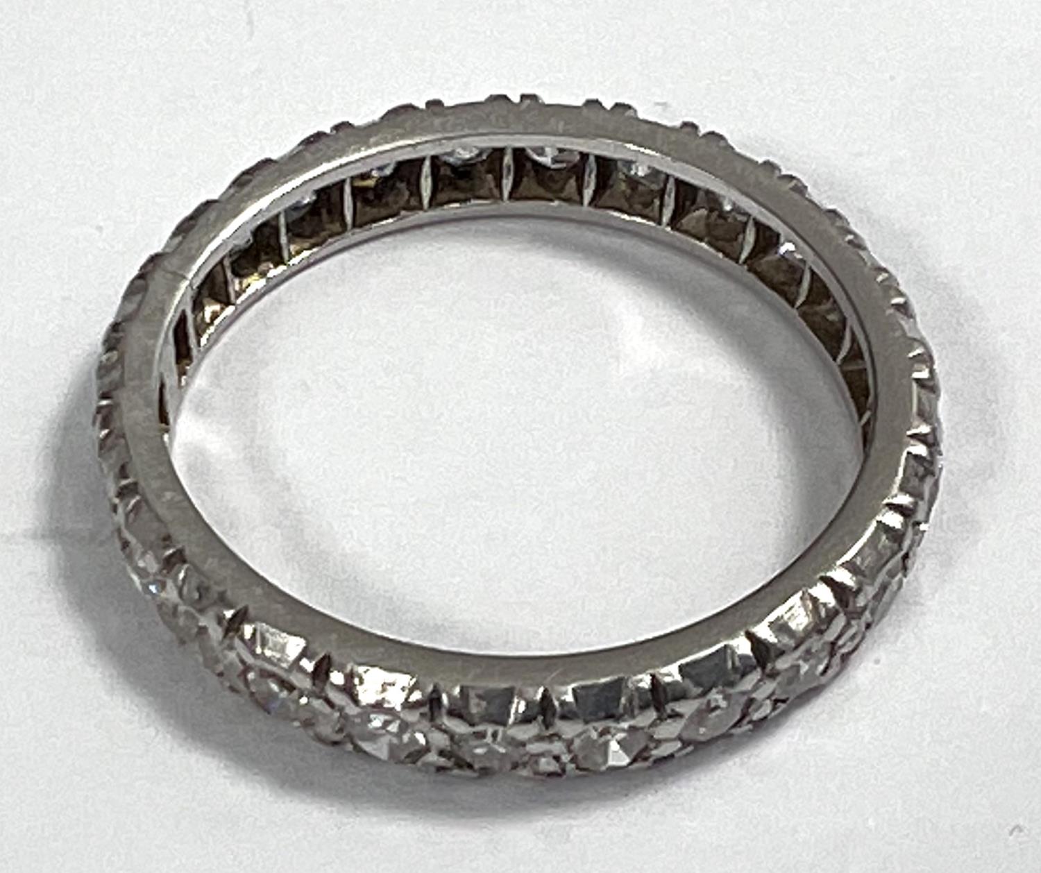 A white metal eternity ring with diamonds in illusion settings, size L, gross 3.3gm - Image 2 of 3