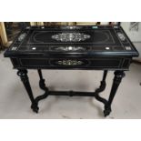 A 19th century ebonised wood fold over card table with extensive scrolled and floral bone inlay