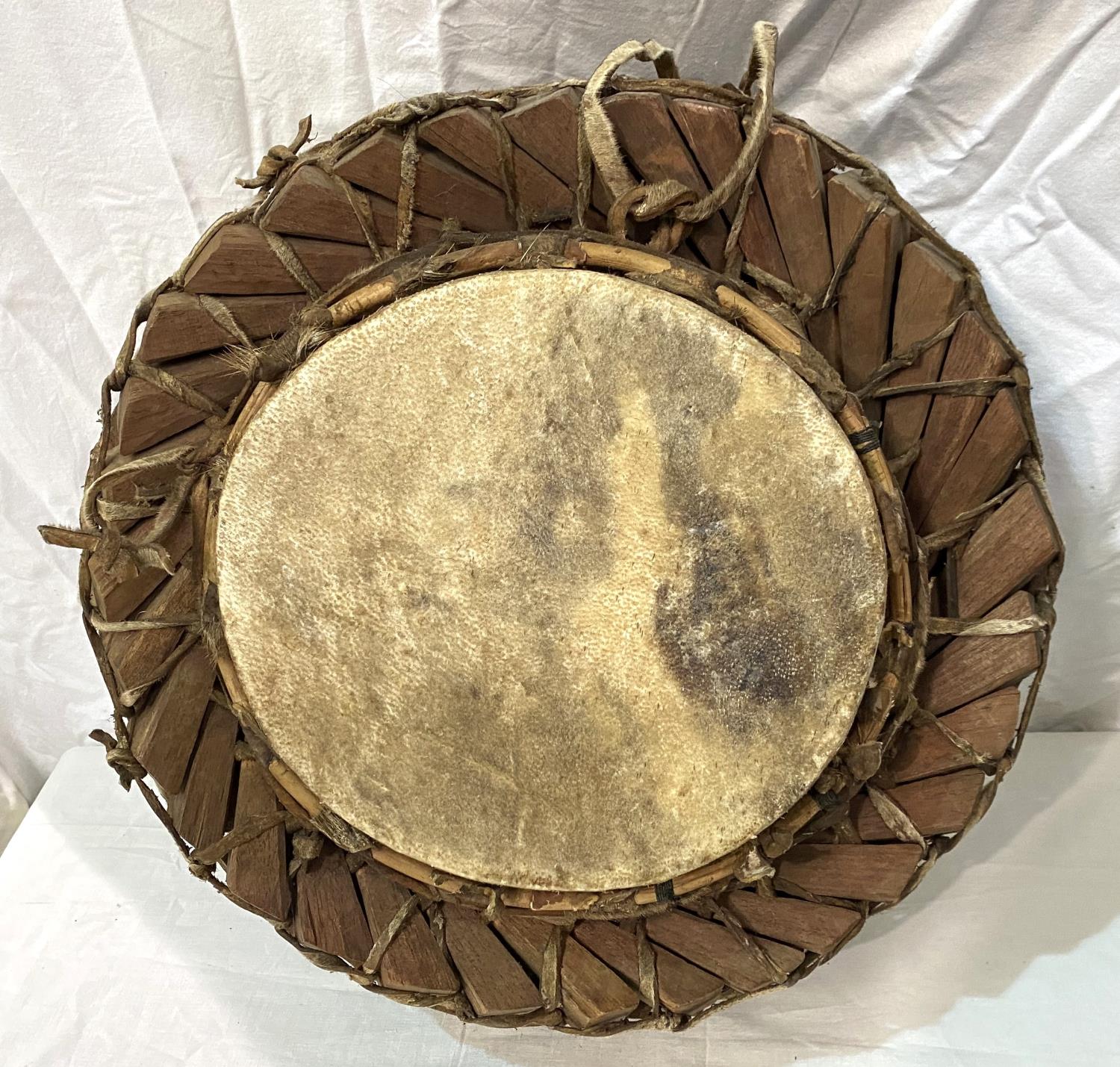 An early to mid 20th century African style tribal drum with interlinking wooden sections, with