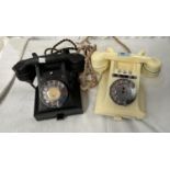Two mid 20th century vintage telephones, black and ivory