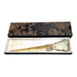 A 17th/18th century carved jade pendant mounted in 19th century silver gilt Chinese paper knife (