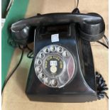 An early 20th century Rotary dial black Bakelite telephone