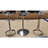 A 1960's pair of stainless steel candlesticks designed by Robert Welch; a similar candle holder