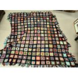 A vintage knitted quilt with multicoloured patchwork style, 210x212 cm