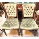 A set of six early 19th century dining chairs with deeply button back green upholstery, carved