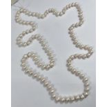 A single strand necklace of 110 pearls, approx, average diameter 7mm, with natural blemishes, length