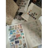 A collection of mainly Commonwealth stamps in 4 albums/stockbook