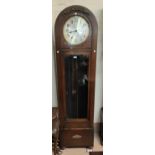 A 1930's grandfather clock in oak dome top case, with triple weight driven movement, height 194cm