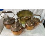 Four copper kettles; a jam pan