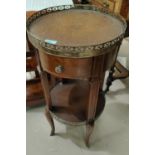 A reproduction 2 tier occasional table with pierced gallery rim, single drawer and similar