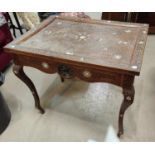 A late 19th/early 20th century Moorish occasional table with extensively carved and inlaid