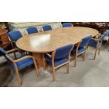 A modern figured ash dining/boardroom suite comprising extending circular dining table and 8