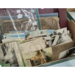 A good selection of vintage postcards in album and loose