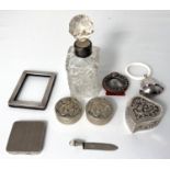 A selection of small silver and white metal decorative pieces including teething rattle boxes etc