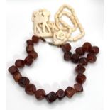 A camel bone necklace; a mid 20th century necklace formed from amber coloured cube shaped beads