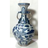 A Chinese blue and white vase in the Yuan manner decorated with birds and double handle, ht. 34cm