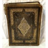 A large leather bound family bible with gilt highlights etc