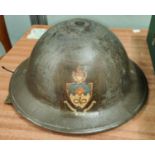 A WWII Civil Defence on Fire Wardens Helmet with crest for the Victoria University of Manchester.