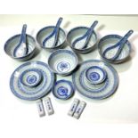 A selection of modern Chinese blue & white rice ware:  5 x 11cm bowls; 3 x 7cm bowls; 4 spoons; 2