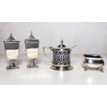 A pair of square pedestal hallmarked silver pepper pots. London 1920; a hallmarked silver salt; a