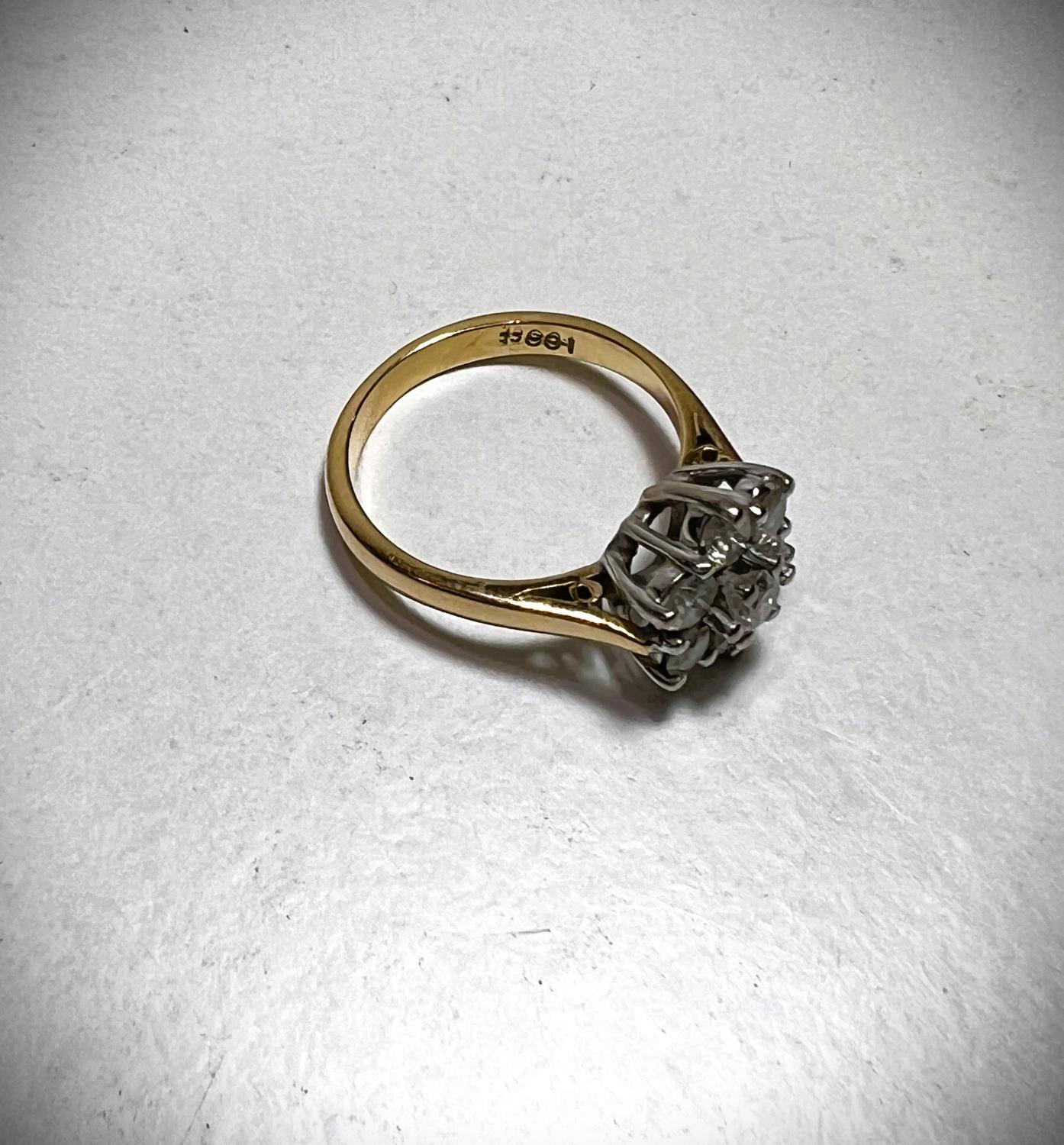 An 18ct hallmarked gold ring set with 7 diamonds in a flowerhead cluster, approximate diamond weight - Image 2 of 2