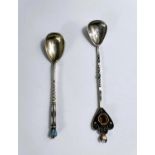 A Russian style white and yellow metal tea spoon set with yellow coloured stone to finial and and
