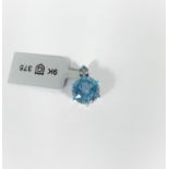 A Wobito Snowflake cut Swiss blue topaz pendant with blue diamond chips to clasp (topaz approx. 5