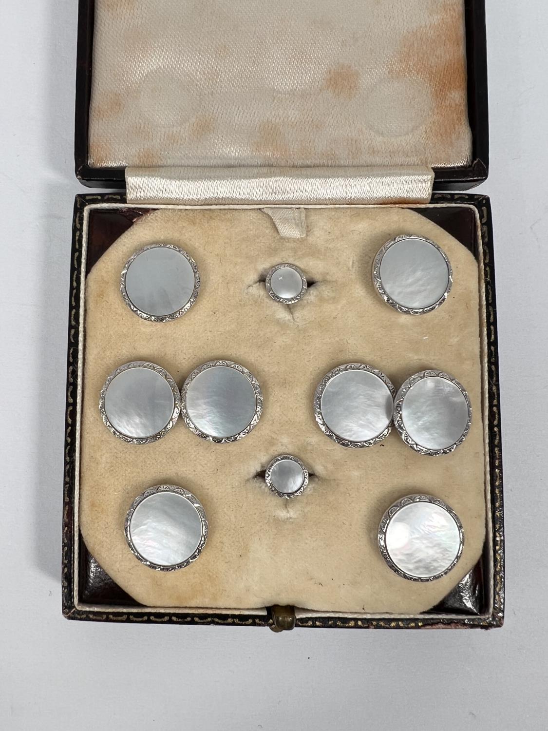 A originally boxed set of 9ct white gold dress studs