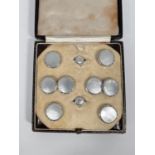 A originally boxed set of 9ct white gold dress studs