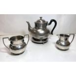 An Ashberry pewter tea service with mottled turquoise decorative beads, comprising teapot, stand,