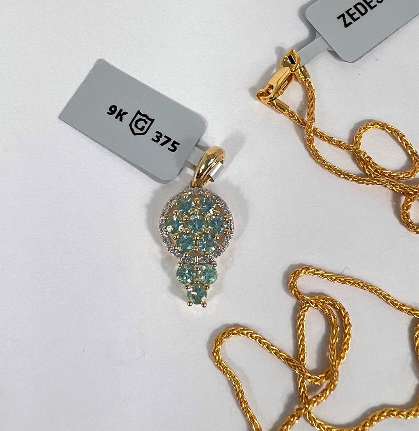 An Aquaiba Beryl pendant with white zircon chips in 9 k gold setting (10 Beryl stones approx.1 carat - Image 2 of 3