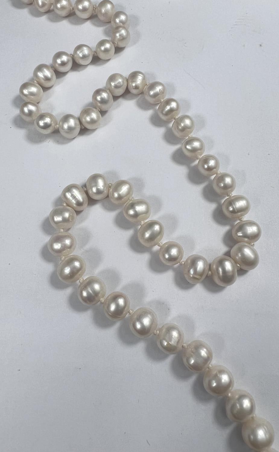 A single strand necklace of 110 pearls, approx, average diameter 7mm, with natural blemishes, length - Image 2 of 2