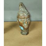 A Nigerian Benin brass bust of a man in pointed hat, height 16.5cm