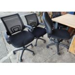Three office arm chairs and two others