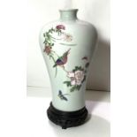 A Chinese ceramic Meiping shaped vase with polychrome decoration of bird on branch butterfly and