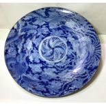 A Chinese blue and white charger decorated with five clawed dragon circling mythical bird, 47cm