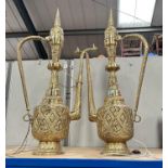 A pair of large brass middle eastern lamps in the form of Jugs, with pierced decoration to the