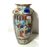 A 19th century Chinese famille verte ovoid vase decorated with reserve panels of women and